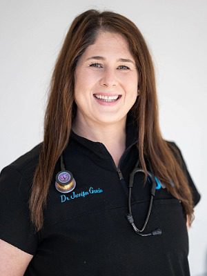 Dr. Jennifer Garcia - female veterinarian with long brown hair wearing a stethoscope around neck
